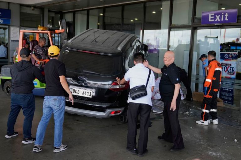 Four-year-old girl and man dead after driver crashes SUV into Manila airport, Red Cross says